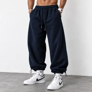 Baggy-style-joggers-3-thread-French-terry-cotton-Length-110-cm-Elastic-waistband-Adjustable-cuffs-with-toggles-Navy-blue-Code-8005-www.heroshoop.com-view-1.webp