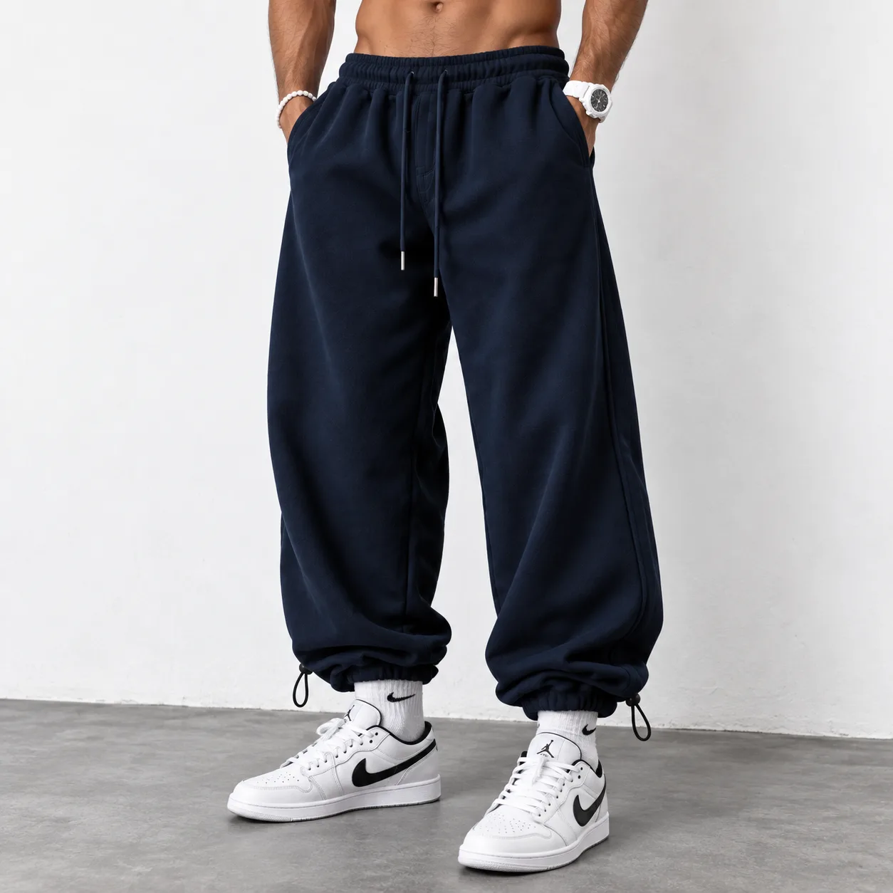 Baggy-style joggers 3-thread French terry cotton Length 110 cm Elastic waistband Adjustable cuffs with toggles Navy blue Code 8005 www.heroshoop.com view 1 Baggy-style-joggers-3-thread-French-terry-cotton-Length-110-cm-Elastic-waistband-Adjustable-cuffs-with-toggles-Navy-blue-Code-8005-www.heroshoop.com-view-1.webp