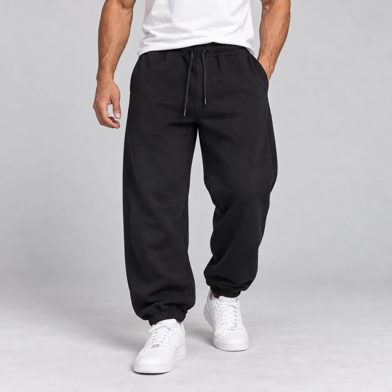 black-extra-baggy-joggers-elastic-cuff1 شلوار جاگر اسپرت مشکی | مدل بگ | دمپا کش | پارچه درجه یک - تصویر 1